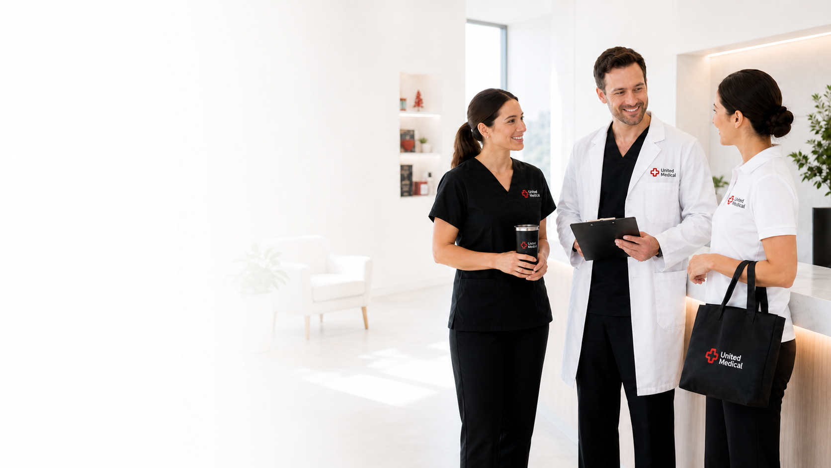 Healthcare team wearing custom United Medical scrubs, lab coat, polo, and branded tote bag in a bright clinic.