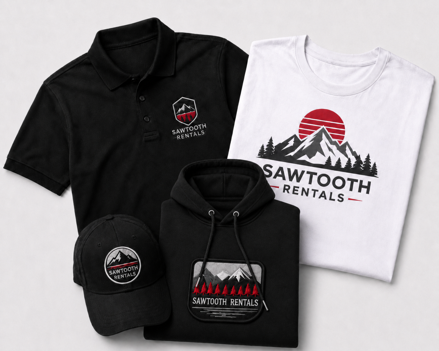 Custom branded apparel mockup featuring Sawtooth Rentals logo on a black polo, white t-shirt, black hoodie, and black hat on a light gray background.